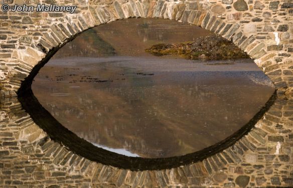 Reflection of Eilean Donan footbridge